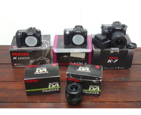 3 Pentax Digital SLR cameras, K100D, ist DL2, and K-7, all boxed, and 3 lenses. (6)