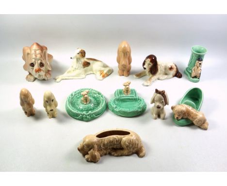 6 Sylvac models of dogs, H.13cm the tallest; dog money box, small dog shaped planter, slipper with dog, vase with dog dressed