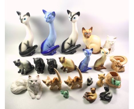 19 Sylvac models of cats, H.33.5cm the tallest; top hat with cat and dog, ball of yarn with cat vase, and 2 other models of c