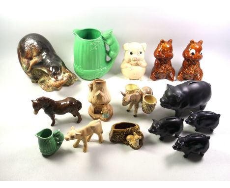Large Sylvac model of an otter, a trout in its mouth, W.24cm; large green acorn jug with squirrel handle, H.20cm; similar sma