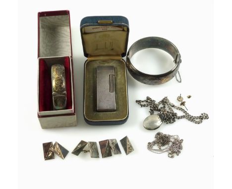 A silver hinged bracelet with chased floral scrolling decoration, by Joseph Bradbury, Birmingham, 1963, 40.1 grams and a simi