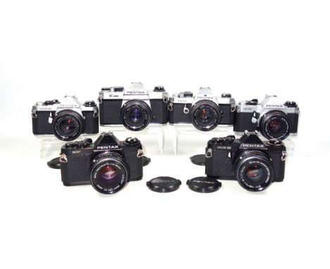 6 Pentax SLR cameras, ME Super, MG, MX, K1000, MV, and a ME Super (black), each with a lens. (12)