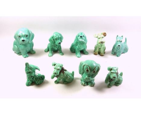 9 Sylvac models of dogs with a green glaze, H.15.5cm the tallest. (9)