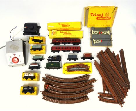 Tri-ang TT gauge rolling stock, locomotive with interchangeable body, and track. Includes two coaches, two mineral trucks, tw
