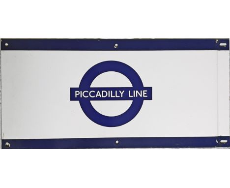 1950s/60s London Underground enamel PLATFORM FRIEZE PLATE for the Piccadilly Line with the line name on the bar of the bullse