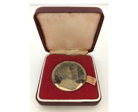 A silver medallion, commemorating John F Kennedy, cased, a medallic first day cover, commemorating the Royal Wedding, cased (