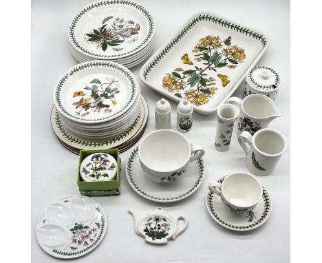 A collection of Portmeirion Botanic Garden tableware including plates, serving dish, oversized teacup, jugs, salt and pepper 