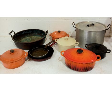 A vintage cast iron Le Creuset cooking pot another and a collection of cast iron cookware, an aluminium cooking pot and a pre