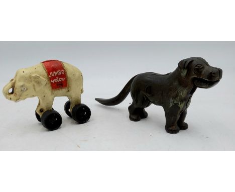 A vintage cast iron money box in the form of Jumbo the elephant, 12cm wide 10cm high, and a cast iron nutcracker in the form 