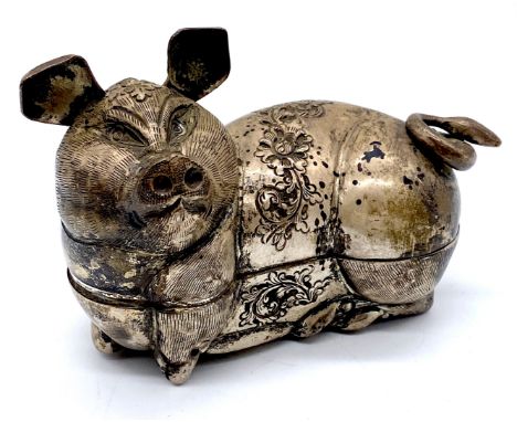 A silver lidded box in the form of a pig (possibly Cambodian) stamped T90 on underside