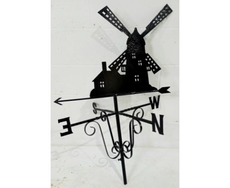 A cast metal weather vane in the form of a windmill, painted black 110cm high 70cm wide.