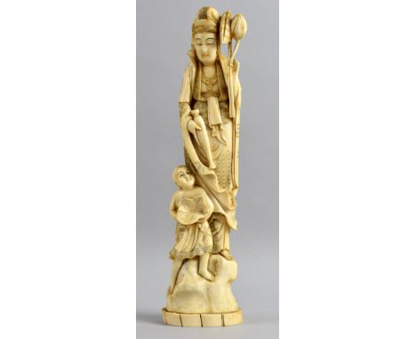 Late 19th/early 20th century Chinese carved ivory figure of a robed woman with a young boy at her feet holding a lily pad, 31