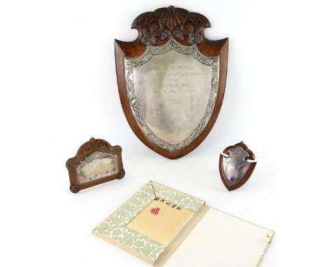 A Chinese white metal and hardwood presentation plaque, inscribed 'To Dr. A.D. Wall/A token of gratitude for your great skill