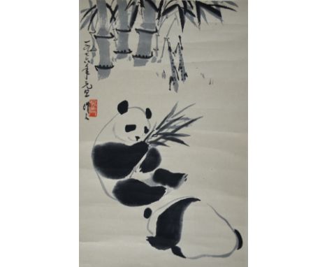A Chinese printed scroll picture of two pandas amongst bamboo; with calligraphy and red seal mark, image size 46.5cm x 28cm. 