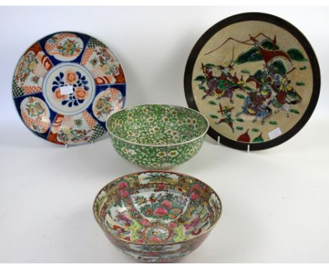 A Japanese Imari dish, 33 cm diameter, Meiji Period or later; a Canton famille rose bowl, 25 cm diameter, with Qianlong mark,