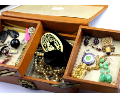 A pigskin covered jewellery case containing a collection of Georgian and later jewellery to include; a garnet set drop earrin