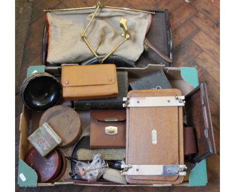 A box containing brushes, trays, boxes, ebony brushes and a lacquered brass fire screen with clamp