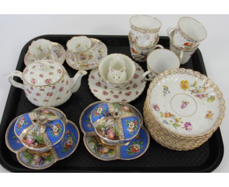 A collection of florally decorated porcelain wares, to include; five Dresden coffee cups, saucers and six side plates, a rose