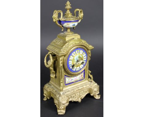 A 19th century French gilt metal eight day mantel clock, with painted porcelain dial and panels, movement striking on a bell,