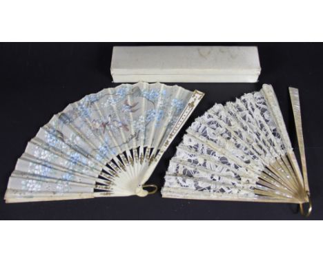 A 19th century French mother of pearl and lace fan, 21.5cm long and a further bone fan with bird painted leaf, 21.5cm long, w