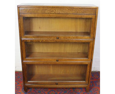 A Globe Wernicke style three section oak bookcase, 112cm x 87cm x 25cm