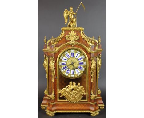 A late 19th century French gilt brass mounted kingwood mantel clock, the top surmounted with a figure of Father Time, above a