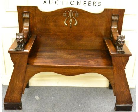 A late 19th century carved oak hall bench 