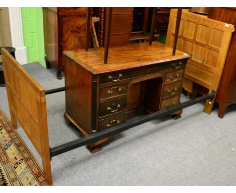 A Robert ''Mouseman'' Thompson oak 3ft single panelled bedstead, the panelled headboard and footboard with penny moulded top,