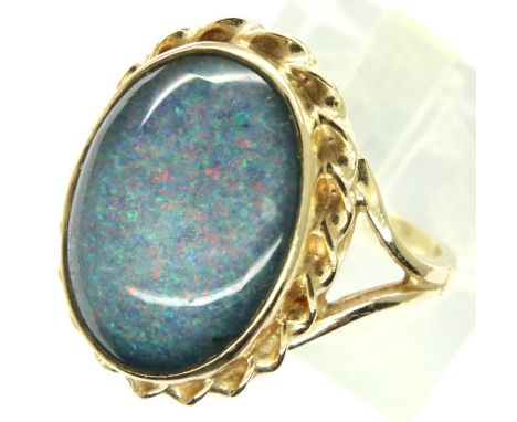 9ct gold ring set with a large cabochon opal, size N, 4.8g. P&amp;P Group 1 (£14+VAT for the first lot and £1+VAT for subsequ