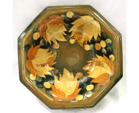 Vintage William Moorcroft octagonal bowl in the grape and leaf design, D: 30 cm. Some paint loss and over glazed chip to base