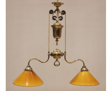 A Christopher Wray brass two branch rise and fall pendant light fitting, late 20th century, complete with a pair of opaline a