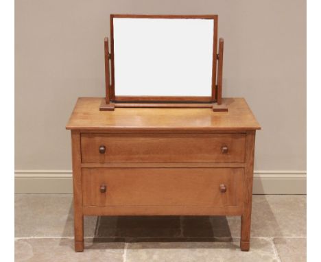 A mid 20th century light oak chest of drawers by Russell of Broadway, maker's label to the rear of the chest, formed from two