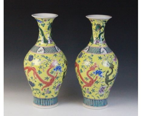 A pair of Chinese porcelain famille jaune vases, Kangxi mark (20th century), of begonia form (Haitangzun) and decorated with 