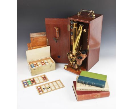 A Ross of London Wenham's binocular lacquered brass microscope, mid 19th century, serial No. 4082, with rack and pinion fine 