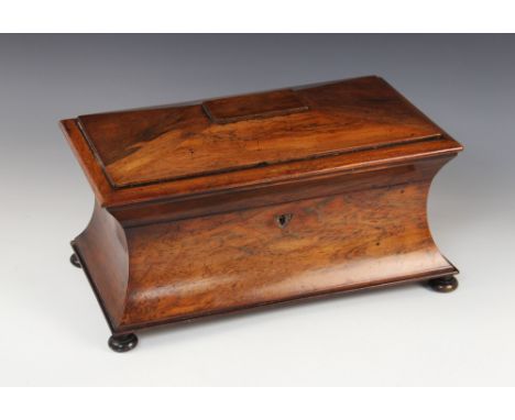 A William IV rosewood sarcophagus tea caddy, the rectangular hinged cover opening to a pair of lidded compartments centred by