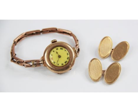 A pair of 9ct gold cufflinks, each link of oval form, one plain polished, the other with engine turned decoration, each measu