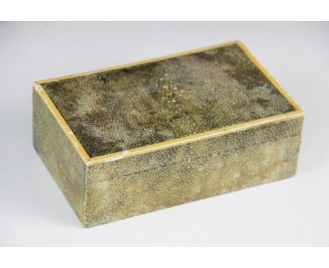 An Art Deco shagreen cigarette box, of rectangular form, ivory mounts to hinged cover, fruitwood lining, 16.6cm W x 10cm D x 