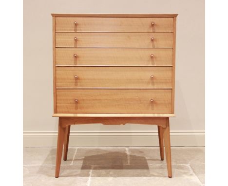 A walnut chest of drawers by Alfred Cox for Maples, mid 20th century, comprising five graduated long drawers each with two co