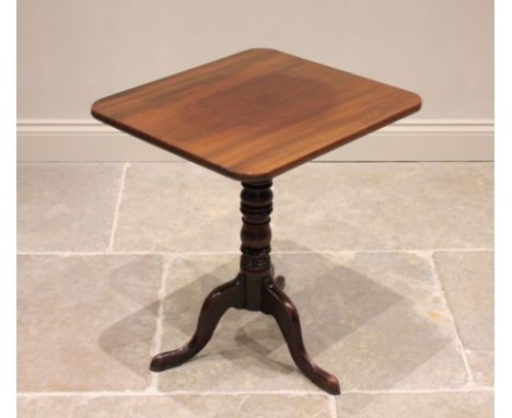 A George III mahogany tripod table, the rectangular tilt top with rounded corners, raised upon a ring turned compressed balus