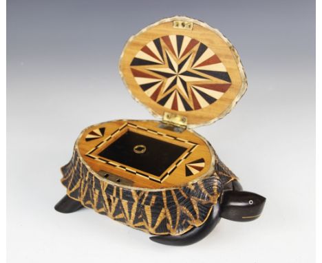 An early 20th century Indian star tortoise tea caddy, the hinged cover opening to a parquetry inlaid interior, detachable cov