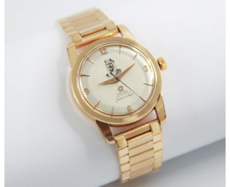 An 18ct gold Omega Automatic Seamaster wristwatch, circa 1960, the champagne dial with gold toned Arabic and baton markers, w