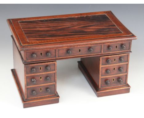An unusual walnut stationery box or apprentice piece formed as a twin pedestal partners desk, late 19th/early 20th century, t