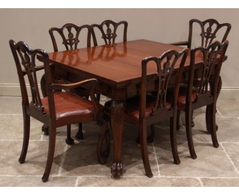 A set of six George II style mahogany dining chairs, early 20th century, each with a leaf swept interlaced splat back above a