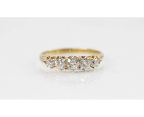 A Victorian five-stone diamond ring, comprising five graduated old cut diamonds, the central diamond measuring 3mm x 3.5mm, c