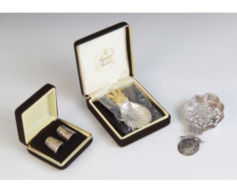 A silver caddy spoon, Roberts &amp; Belk, Sheffield 1974, with shell form bowl and gilt handle modelled as Prince of Wales fe