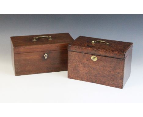 A George III mahogany tea caddy, the hinged cover with brass swing handle opening to twin compartments with hinged covers, ce