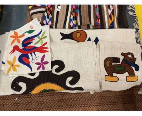AN ASSORTMENT OF ANIMAL THEMED TEXTILES IN THE AZTEC STYLE 
