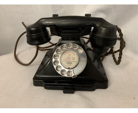 A VINTAGE BLACK BAKELITE TELEPHONE WITH NUMBER STORAGE DRAWER 