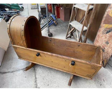 A VINTAGE WOODEN CHILDRENS ROCKING CRIB 