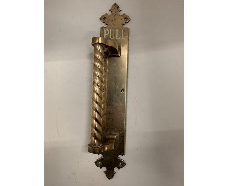 A VERY HEAVY VINTAGE BRASS DOOR HANDLE 